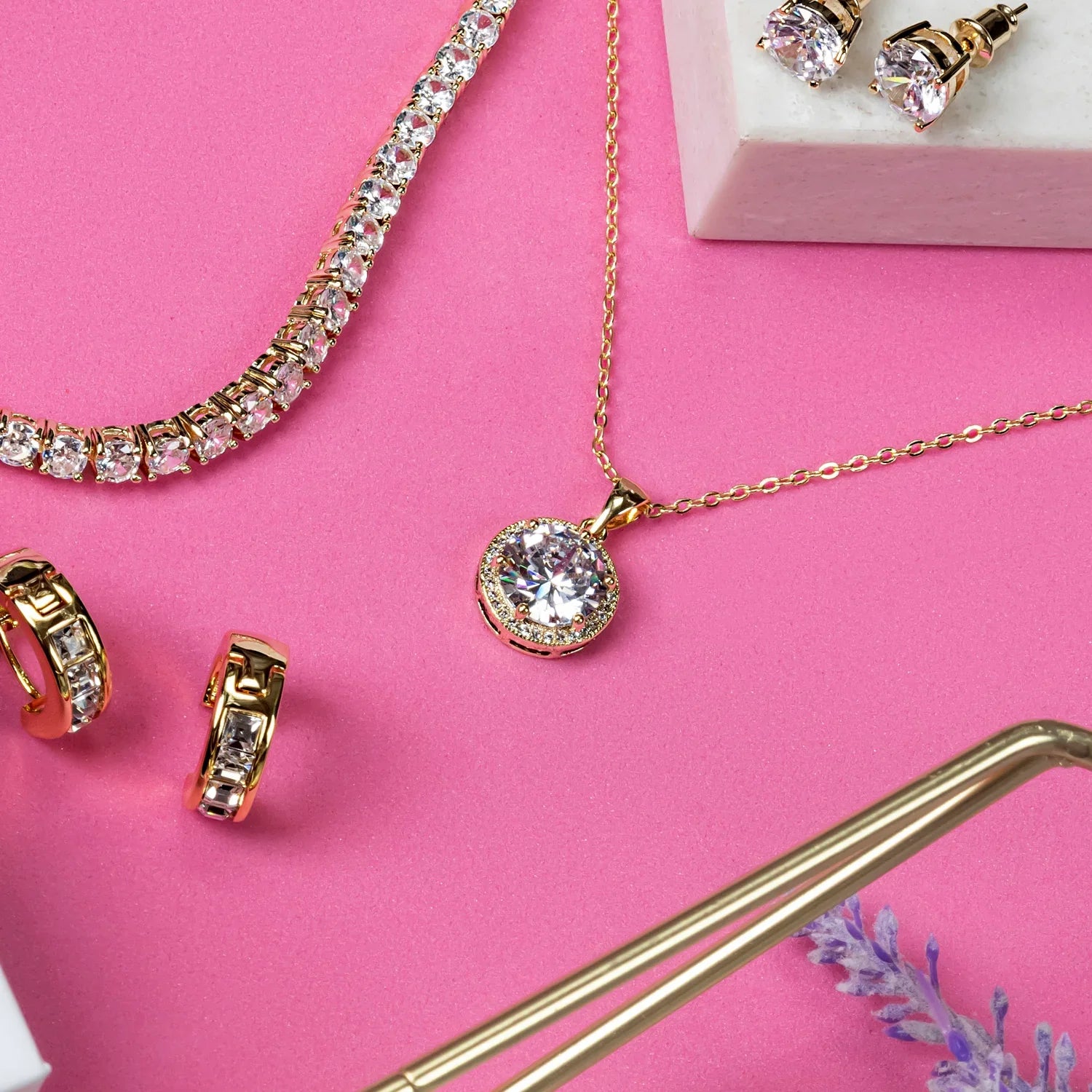 Gold plated necklace extender with lobster clasp for adjustable length, adding versatile glam to your jewelry collection